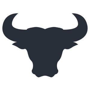 May include: A dark charcoal gray silhouette of a bull head featuring prominent, curved horns extending outward and upward, with a defined snout and pointed ears, presented as a solid graphic icon against a plain white background.