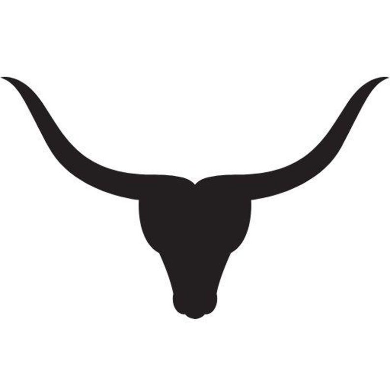May include: A solid black silhouette graphic of a longhorn steer head. The design features a symmetrical shape with two long, curved horns extending outward from the top of the head, tapering to points, and a narrow, downward-pointing snout.