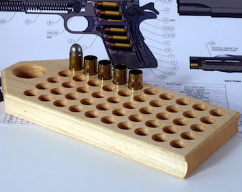 Maple reloading block with standard depth holes for pistol calibers