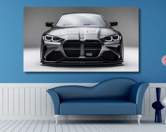 May include: A rectangular wall art print featuring a front-facing view of a metallic silver BMW M4 sports car. The vehicle displays a prominent black kidney grille, sharp angular LED headlights, and a low-profile front bumper design.