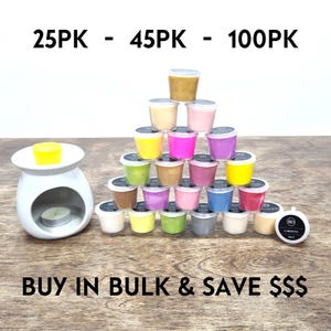 May include: A pyramid of colourful wax melts in various sizes, with a white ceramic wax warmer in the foreground. The text "25PK - 45PK - 100PK" is displayed above the wax melts. The text "BUY IN BULK & SAVE $$$" is displayed below the wax melts.