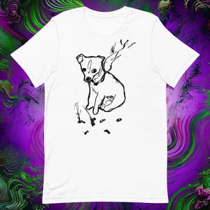 May include: A black and white line drawing of a small dog with a scarf on a white t-shirt.