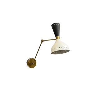 May include: A black and white wall sconce with a brass arm and a white shade with holes. The sconce is adjustable and can be tilted up or down.