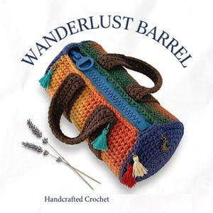 May include: A handcrafted crochet barrel bag with a rainbow gradient design. The bag features a blue zip, brown handles, and decorative tassels. Text on the bag reads "WANDERLUST BARREL" and "Handcrafted Crochet".
