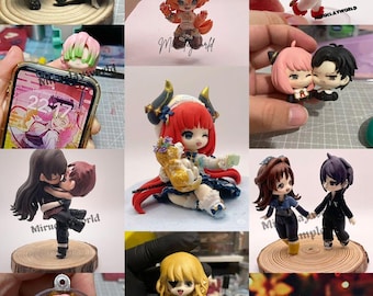 May include: A collection of handmade polymer clay figurines. The figurines are of various characters, including a fox, a demon girl, a couple, and a girl with a cat. The figurines are all painted in bright colors and have intricate details.