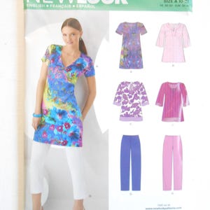 May include: New Look sewing pattern 6983, size A 10-22, featuring illustrations of tunics and pants. The envelope displays a blue, pink, and yellow floral tunic, along with variations of tunics with three-quarter sleeves and straight-leg pants.