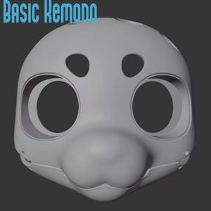 Puede incluir: Un modelo digital tridimensional de color gris claro y superficie lisa de una base de máscara de cabeza de animal estilizada con grandes cuencas oculares circulares, aberturas ovaladas para las cejas y un hocico redondeado. El texto BASIC KEMONO aparece en azul.