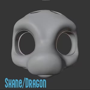 May include: A light gray, smooth, three-dimensional digital model of a stylized creature head with large, circular eye sockets and a rounded snout. The text "SKANE/DRAGON" is printed in light blue at the bottom of the image.