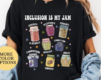 May include: Black t-shirt with the text "Inclusion is my jam" and a graphic of jars of jam with words like "diversity", "acceptance", "educate", "compassion", and "empathy" on each jar.