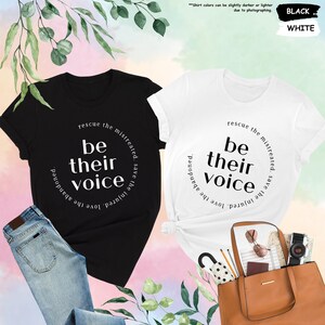 two t - shirts with the words be their voice printed on them