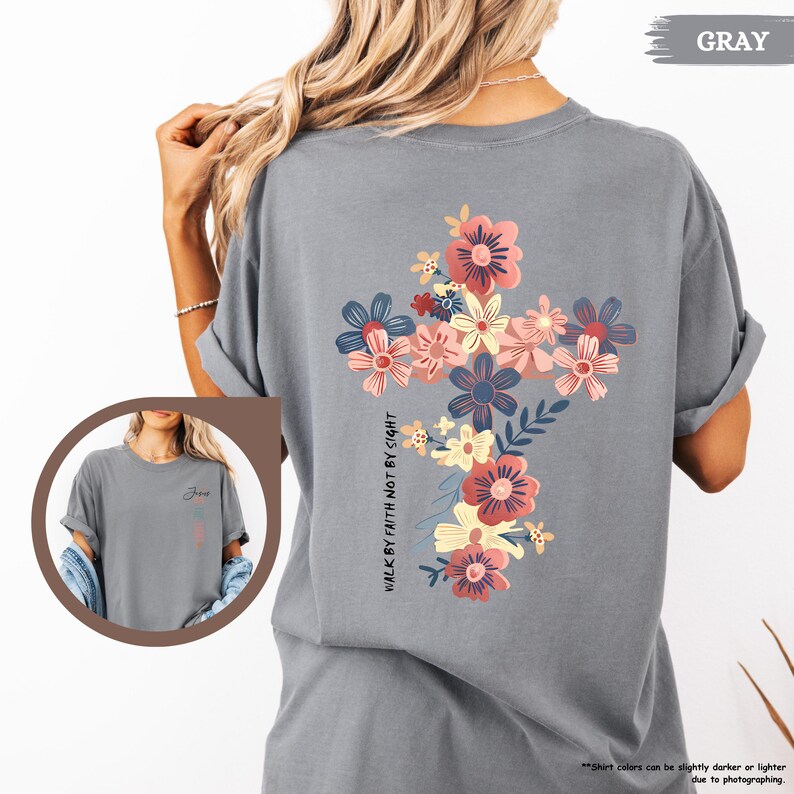 May include: Gray t-shirt with a floral cross design and the text "WALK BY FAITH NOT BY SIGHT".