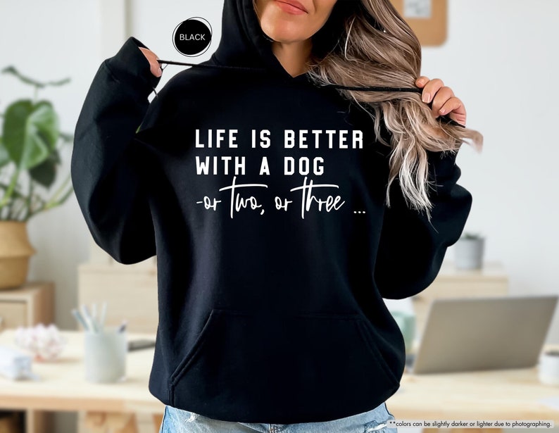May include: Black hooded sweatshirt with the text "LIFE IS BETTER WITH A DOG -or two, or three..." in white.