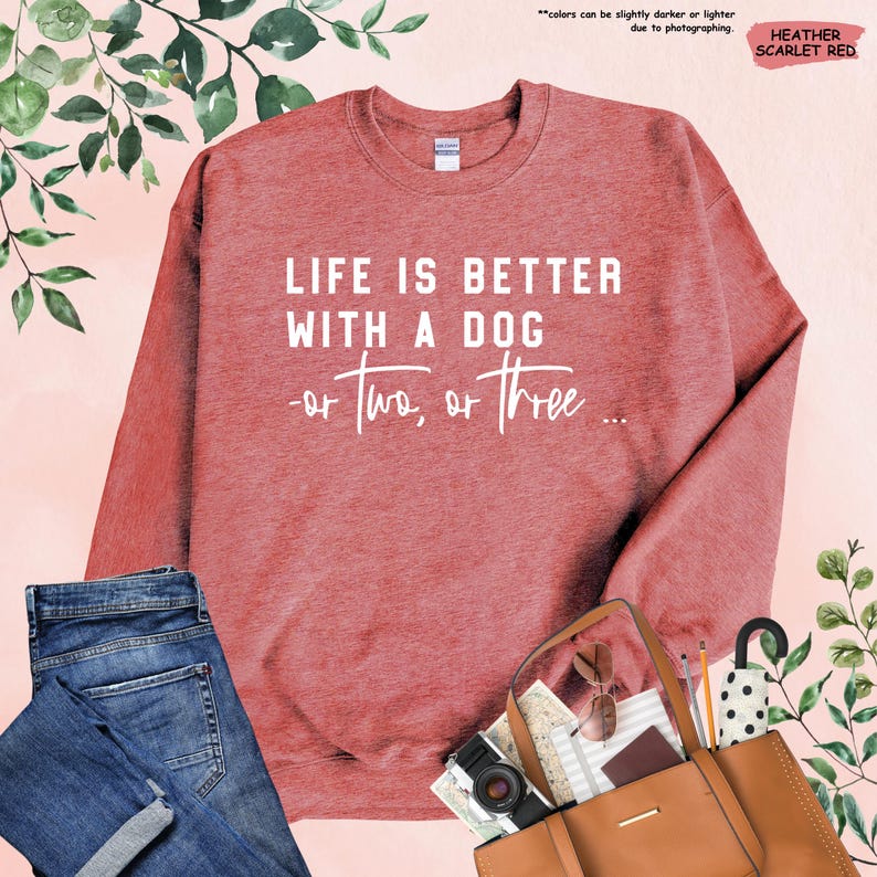 May include: Heather scarlet red sweatshirt with the text "Life is better with a dog - or two, or three..." printed in white.