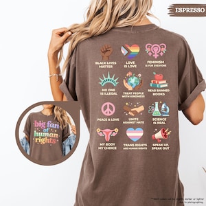 May include: Espresso-colored t-shirt with various graphic designs promoting social justice and equality. The shirt features phrases like "Black Lives Matter," "Love is Love," and "Feminism is for Everyone." The shirt also has the text "big fan of human rights."