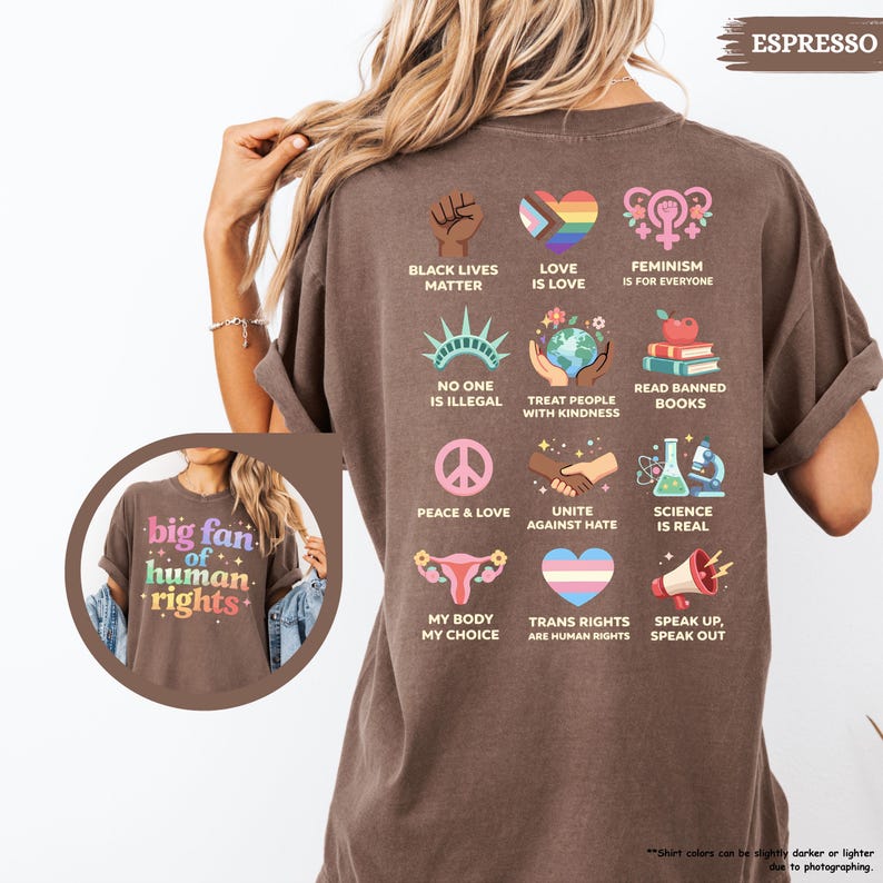 May include: Espresso-colored t-shirt with various graphic designs promoting social justice and equality. The shirt features phrases like "Black Lives Matter," "Love is Love," and "Feminism is for Everyone." The shirt also has the text "big fan of human rights."