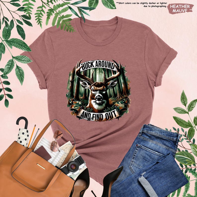 a women's t - shirt with a picture of a deer in the woods