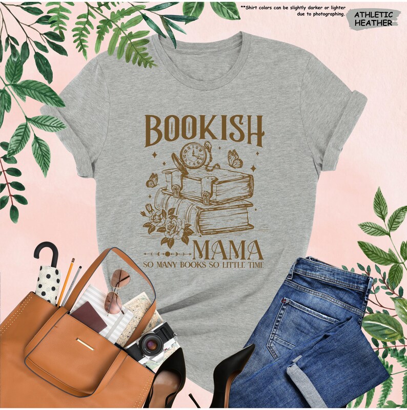 May include: Athletic heather gray t-shirt with a brown graphic that reads "Bookish Mama" with a stack of books, clock, and butterflies. The text "So many books so little time" is below the graphic. Rolled sleeves and a crew neck.