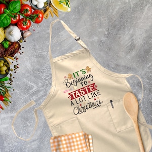 It&#39;s Beginning To Taste A Lot Like Christmas Apron, Family Christmas Gift, Mom Dad Xmas Gift, Baker Cooker Xmas,Merry Christmas,Kitchen Xmas
