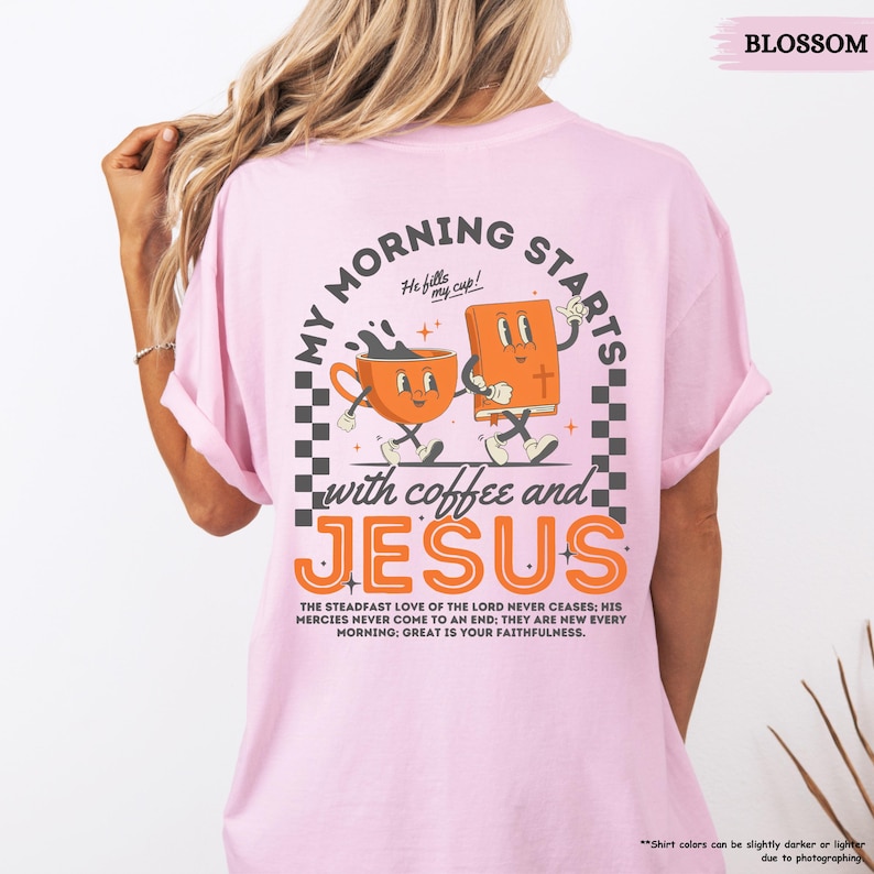 May include: Pink t-shirt with a graphic of a coffee cup and a bible with the text "My Morning Starts with Coffee and Jesus". The text "The steadfast love of the Lord never ceases: His mercies never come to an end; they are new every morning; great is your faithfulness." is printed below the graphic.