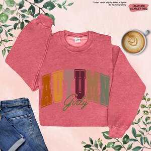 a pink sweater with the word autumn on it