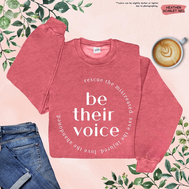 a red sweatshirt with the words be their voice on it
