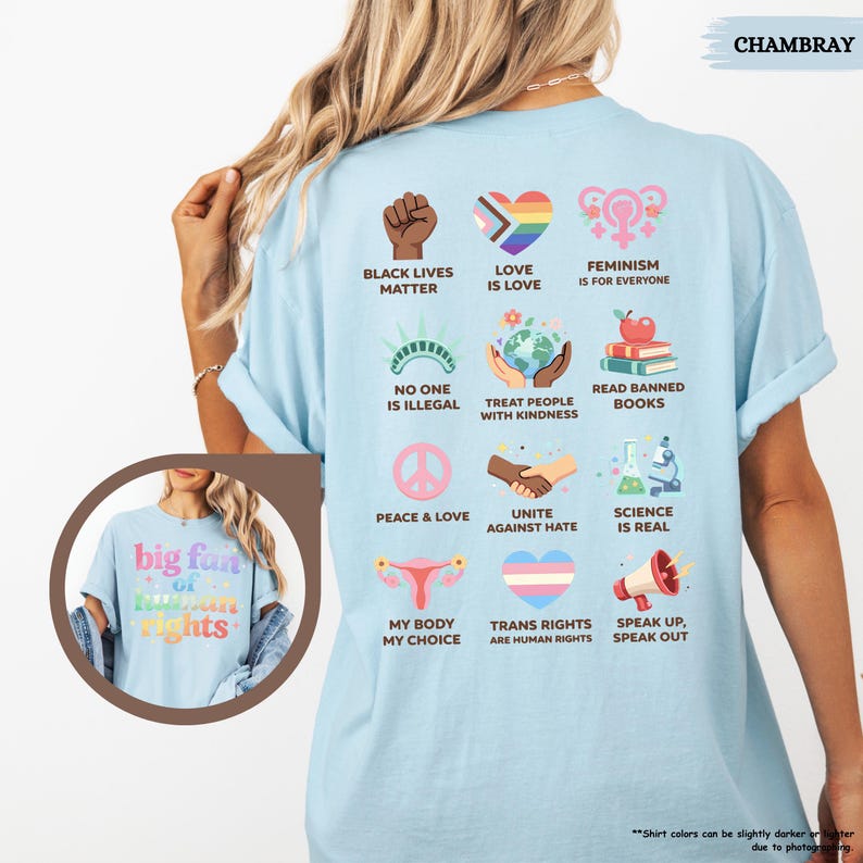 May include: Light blue t-shirt with various graphic designs and text, including "Black Lives Matter," "Love is Love," and "Feminism is for Everyone." The shirt also features the text "big fun of human rights" on the front. The shirt is made of a soft material.