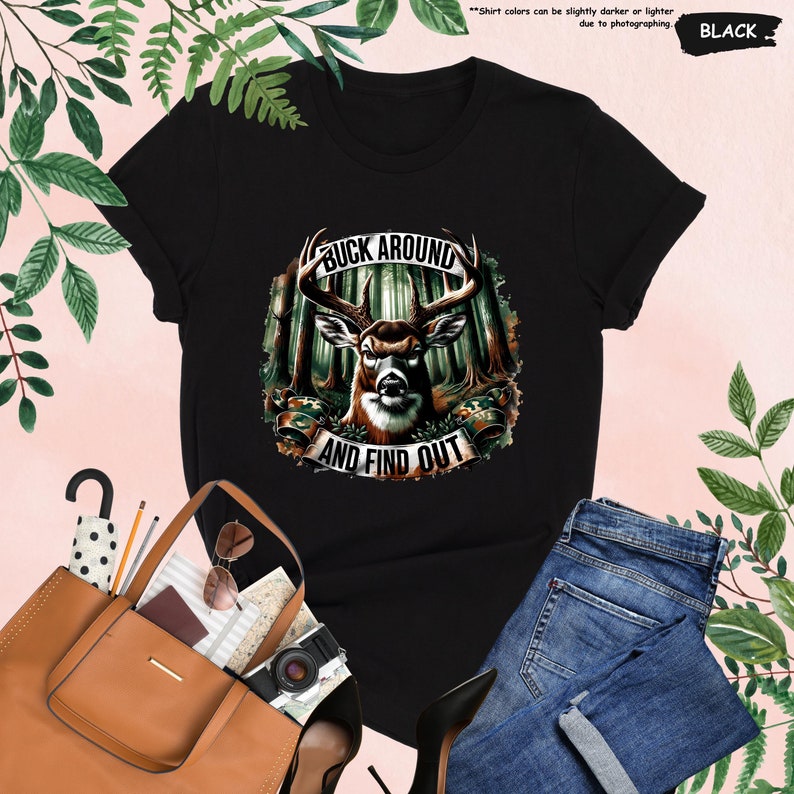 a women's black shirt with a picture of a deer on it