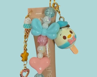 Llavero con cuentas y dijes de brillo/bálsamo labial del Pato Donald de Disney Munchlings