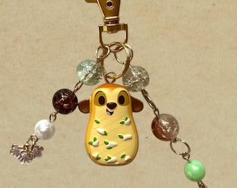 Llavero con cuentas y dijes de Timón Disney Munchlings