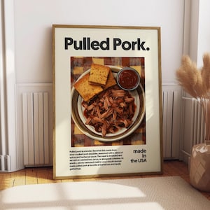 May include: A close-up of a plate of pulled pork with a side of cornbread and barbecue sauce. The text "Pulled Pork. Made in the USA" is printed below the image.