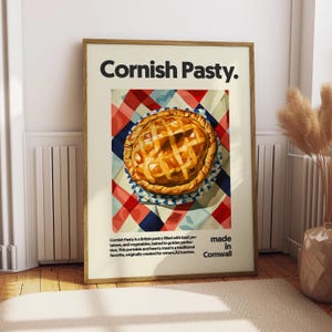 May include: A poster with a red and white checkered background featuring a Cornish pasty. The pasty is a traditional British food made in Cornwall. The text on the poster reads "Cornish Pasty. made in Cornwall."