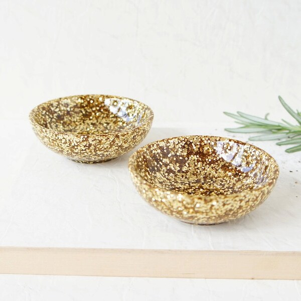 Pair of two small resin salt and pepper spice pinch trinket dish bowls in gold glitter sparkle.