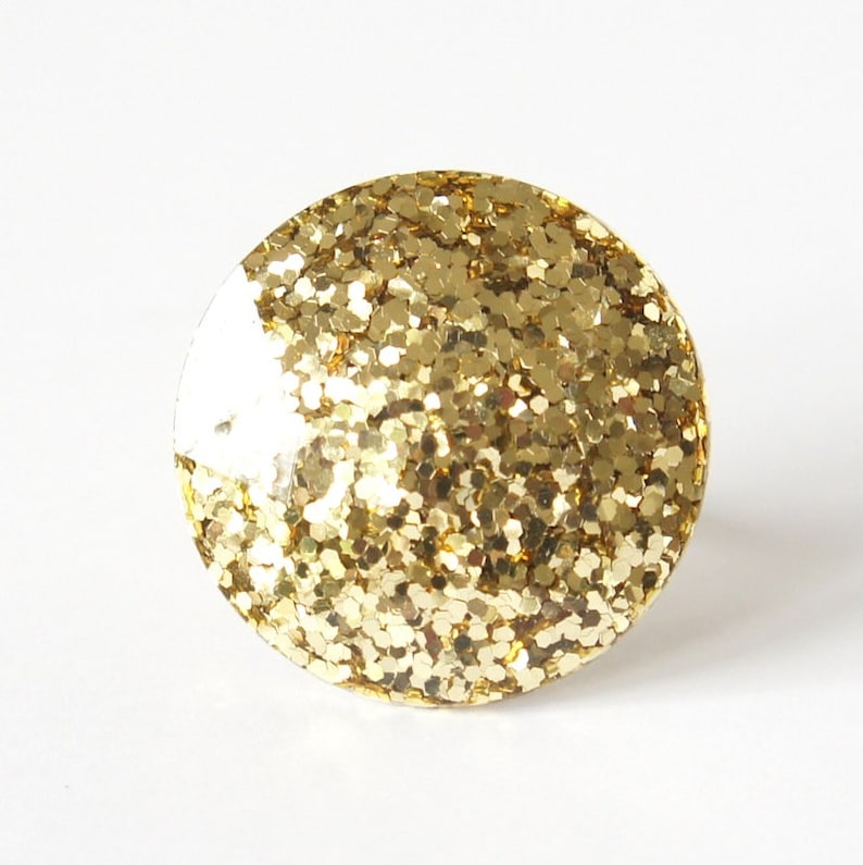 Round Resin Ring Abstract chunky large gem gemstone statement costume piece in gold glitter.