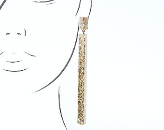 Handmade large long chandelier drop facet geometric statement dangle resin earrings in gold glitter sparkle.