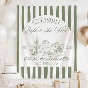May include: A white and green striped backdrop with the text "Scottsdale Before the Veil" in a cursive font. The backdrop also features a desert scene with cacti and the text "Ellie's Bachelorette Scottsdale, AZ" and "EST. 2025".