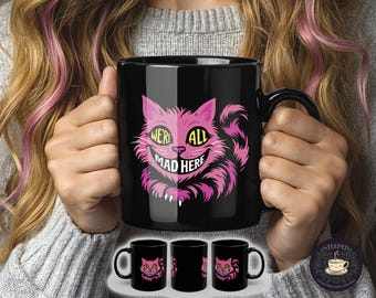 Cheshire Cat, We're All Mad Here, Trendy Black Mug (11oz, 15oz) in Pink, Blue, & Purple. Perfect for Alice in Wonderland fans or Tea Lovers