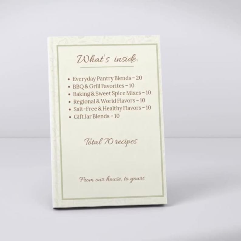 May include: A cream-colored recipe book with a decorative border. The cover reads "What's inside:" followed by a list of spice blends and the text "Total 70 recipes." The bottom of the book says "From our house, to yours."