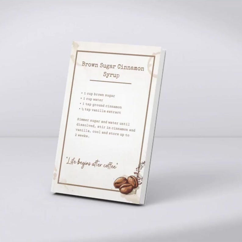May include: A rectangular sign with a recipe for Brown Sugar Cinnamon Syrup. The recipe includes brown sugar, water, ground cinnamon, and vanilla extract. The sign has a light brown border and features coffee beans and the phrase "Life begins after coffee."