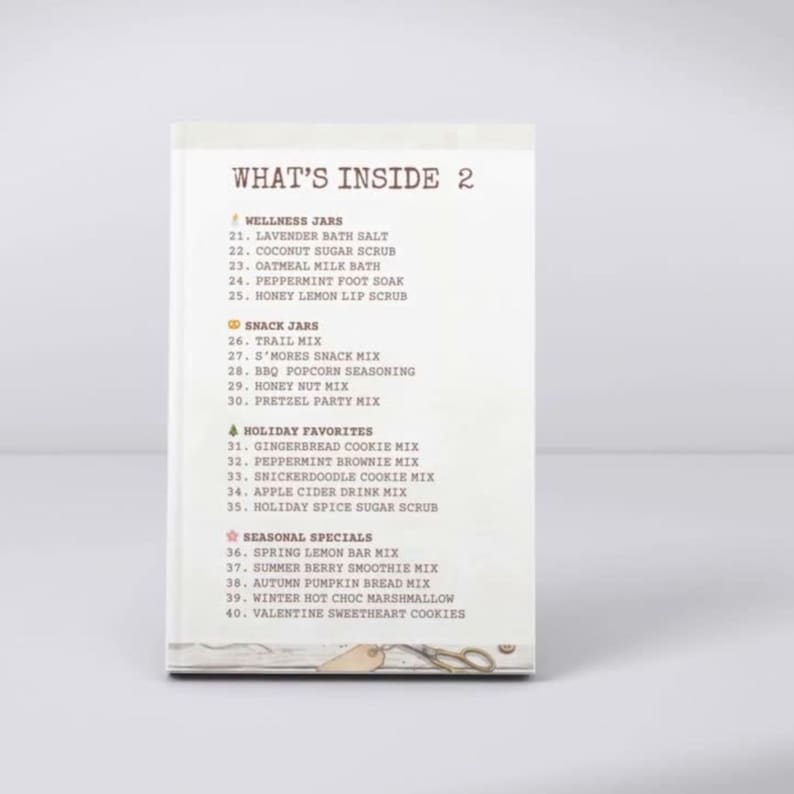 May include: A white rectangular card with the heading WHAT'S INSIDE 2. It lists items under four categories: WELLNESS JARS, SNACK JARS, HOLIDAY FAVORITES, and SEASONAL SPECIALS, numbered 21 through 40, with small icons next to each category title.
