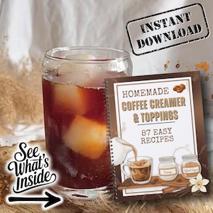 May include: A glass of iced coffee next to a spiral-bound book titled "Homemade Coffee Creamer & Toppings" with 87 easy recipes. The book features illustrations of coffee and ingredients. The image also includes the text "Instant Download" and "See What's Inside".