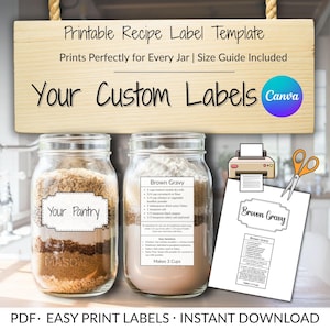 May include: A wooden sign with the text "Printable Recipe Label Template" hangs above two glass jars filled with ingredients. The jars have labels that read "Your Pantry" and "Brown Gravy". A printed recipe and scissors are also visible.