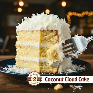 May include: A slice of Coconut Cloud Cake with three layers of yellow sponge cake and white frosting, topped with shredded coconut. A silver fork is inserted into the side of the cake, lifting a small piece. The cake sits on a dark blue plate.