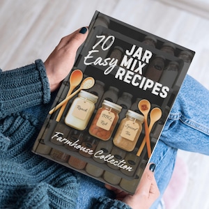 May include: A cookbook titled "70 Easy Jar Mix Recipes" from the Farmhouse Collection. The cover features jars labeled Ranch, BBQ Rub, and Spiced Tea, with wooden spoons. The background shows a shelf of jars.