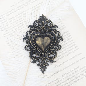 black ex voto heart, romantic baroque wall decoration, Bridgerton-inspired luxury interior.