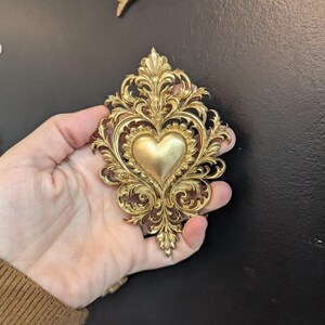 Gold sacred heart ex voto wall decor, baroque romantic style, Marie-Antoinette inspired, elegant curiosity cabinet.