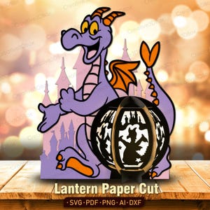 May include: A purple dragon paper cut design with orange accents, a castle silhouette, and a black lantern. The lantern features a cut-out design of a dragon and castle. The text "Lantern Paper Cut" is at the bottom.