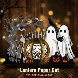 May include: A Halloween paper cut design depicting a graveyard scene with a tree, bats, and a crow. The design includes a glowing pumpkin lantern with a skull design, ghosts, and jack-o'-lanterns. The text "Lantern Paper Cut" is at the bottom.