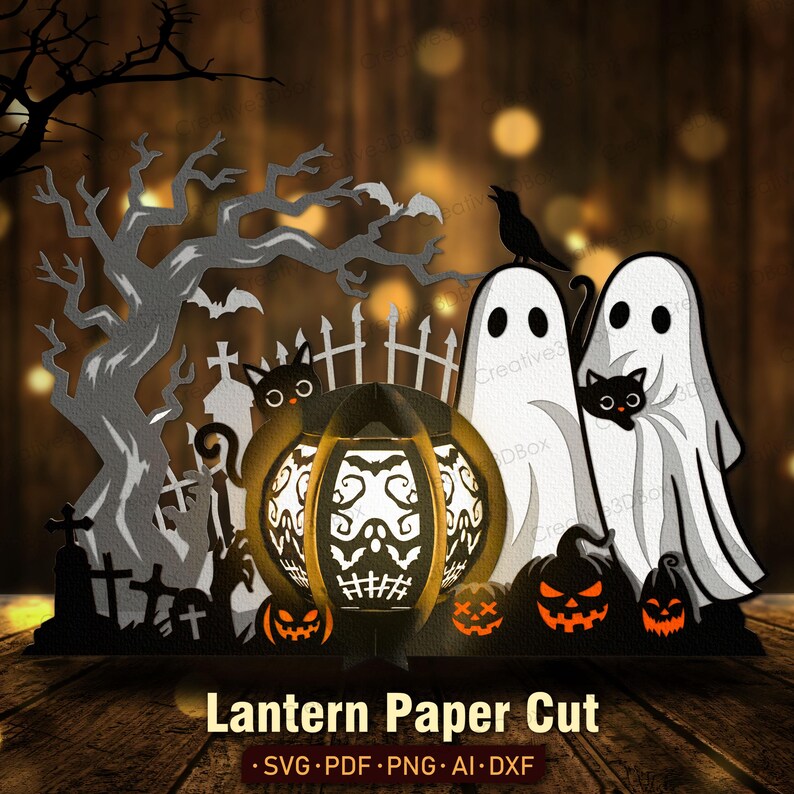 May include: A Halloween paper cut design depicting a graveyard scene with a tree, bats, and a crow. The design includes a glowing pumpkin lantern with a skull design, ghosts, and jack-o'-lanterns. The text "Lantern Paper Cut" is at the bottom.