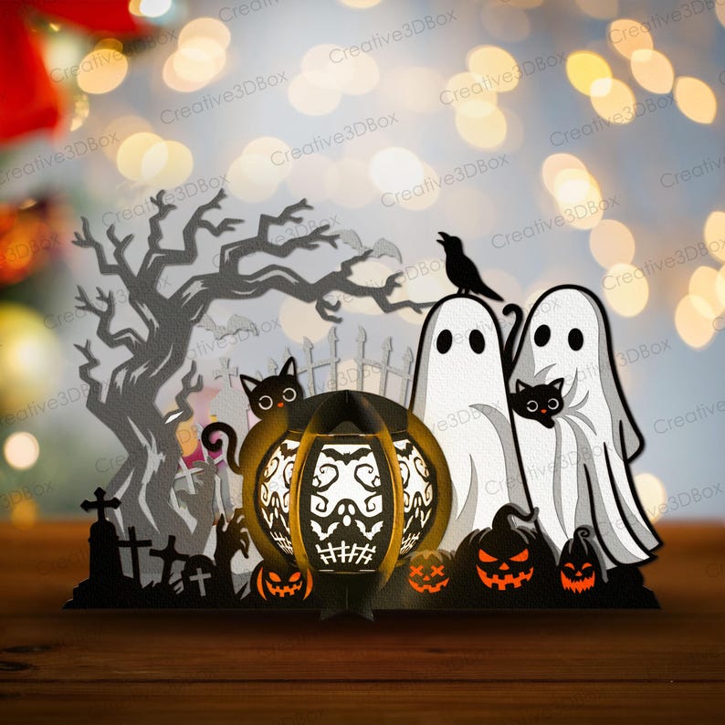 May include: A Halloween papercraft scene with a spooky tree, graveyard, ghosts, black cats, and jack-o'-lanterns. A large, illuminated pumpkin lantern with a skull design is the centerpiece. The scene is set on a wooden surface.