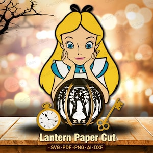May include: A paper cut design featuring Alice from Alice in Wonderland, with a lantern, a pocket watch, and a key. The design is in yellow, black, and white, with the text "Lantern Paper Cut" at the bottom.
